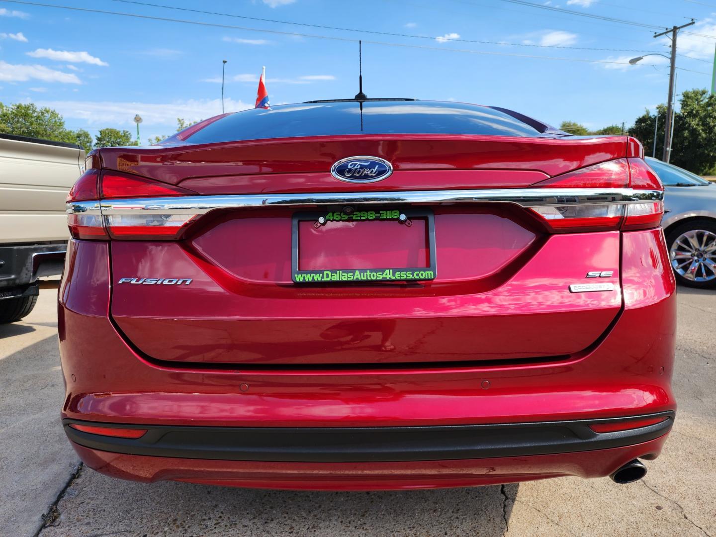 2018 RED Ford Fusion SE (3FA6P0HD2JR) with an 1.5L L4 DOHC 16V engine, 6A transmission, located at 2660 S.Garland Avenue, Garland, TX, 75041, (469) 298-3118, 32.885551, -96.655602 - Welcome to DallasAutos4Less, one of the Premier BUY HERE PAY HERE Dealers in the North Dallas Area. We specialize in financing to people with NO CREDIT or BAD CREDIT. We need proof of income, proof of residence, and a ID. Come buy your new car from us today!! This is a SUPER CLEAN 2018 FORD FUSIO - Photo#4